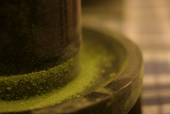 Matcha is crushed in a stone mill