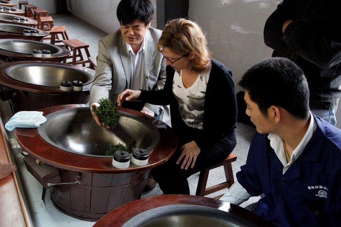 Carine Baudry helping in the making of a Long Jing