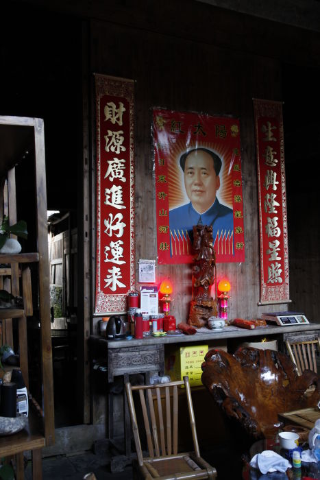 Gifts beneath a portrait in China